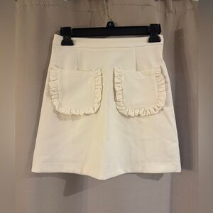 Oisos Cream Skirt with Ruffle Pockets